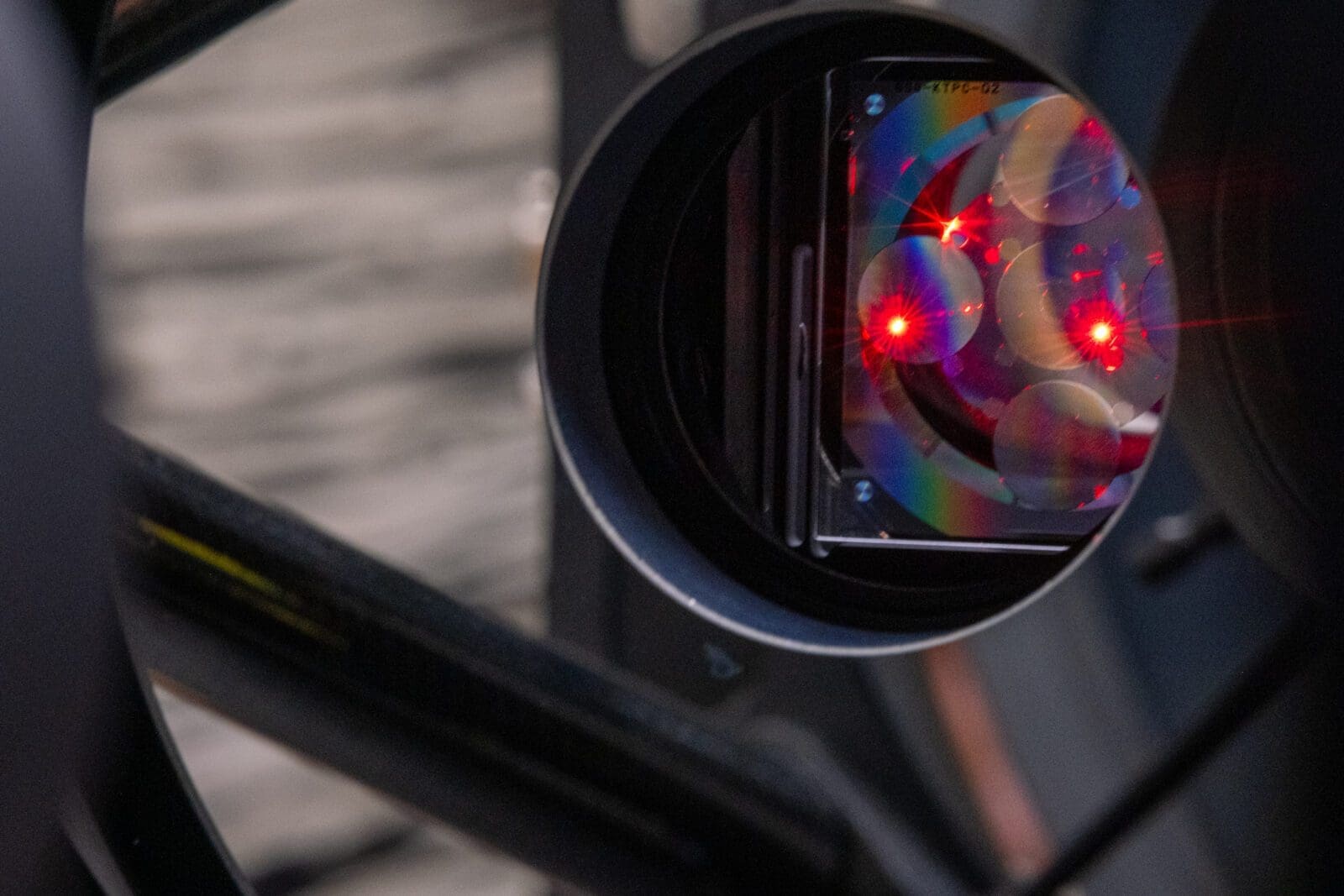 The hologram inside of a telescope system glows with the light of an interferometer